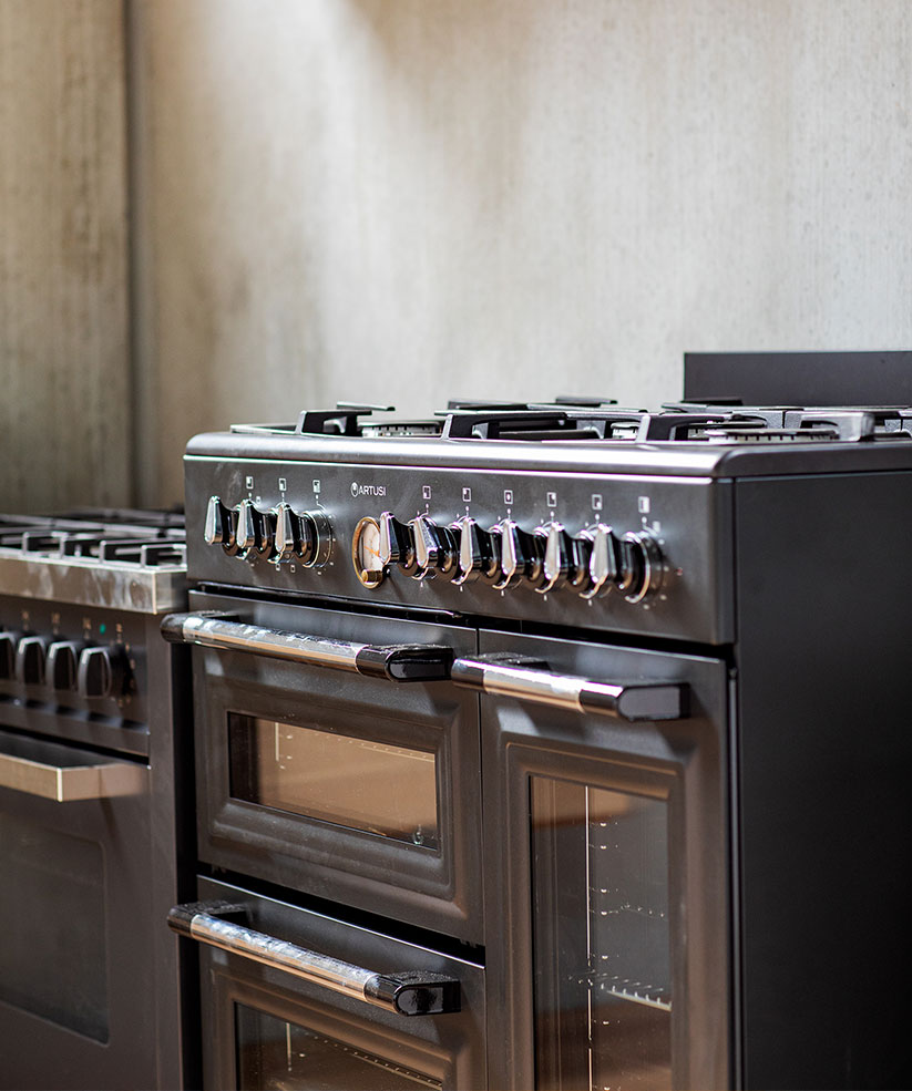 A high quality stove displayed in a showroom stuido